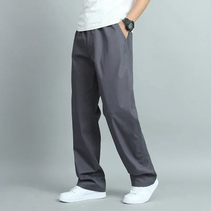 Pantalon droit gris anthracite à taille élastique, jambe large et poches latérales