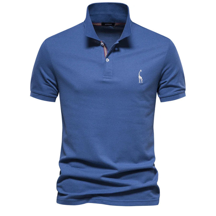 Polo en piqué bleu roi, patte de boutonnage à liseré rayé et girafe brodée blanche