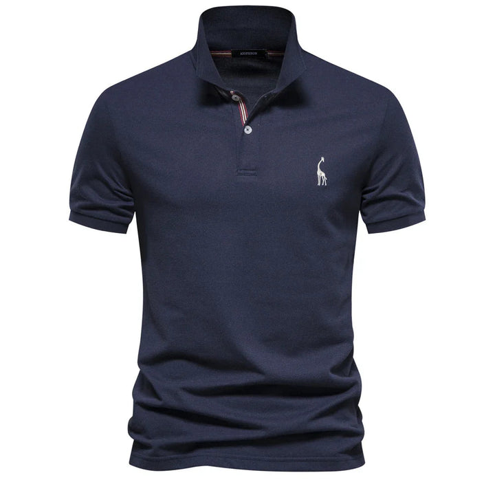 Polo en piqué bleu marine, girafe brodée blanche et col à liseré rayé