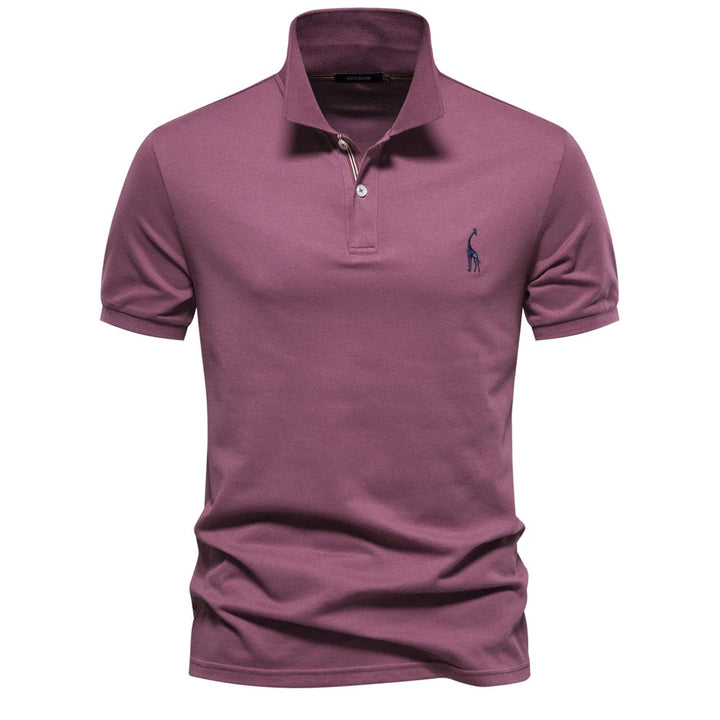 Polo en piqué vieux rose, girafe brodée bleue et patte à liseré rayé