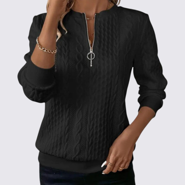 Pull à col zippé, coloris noir, vu de face