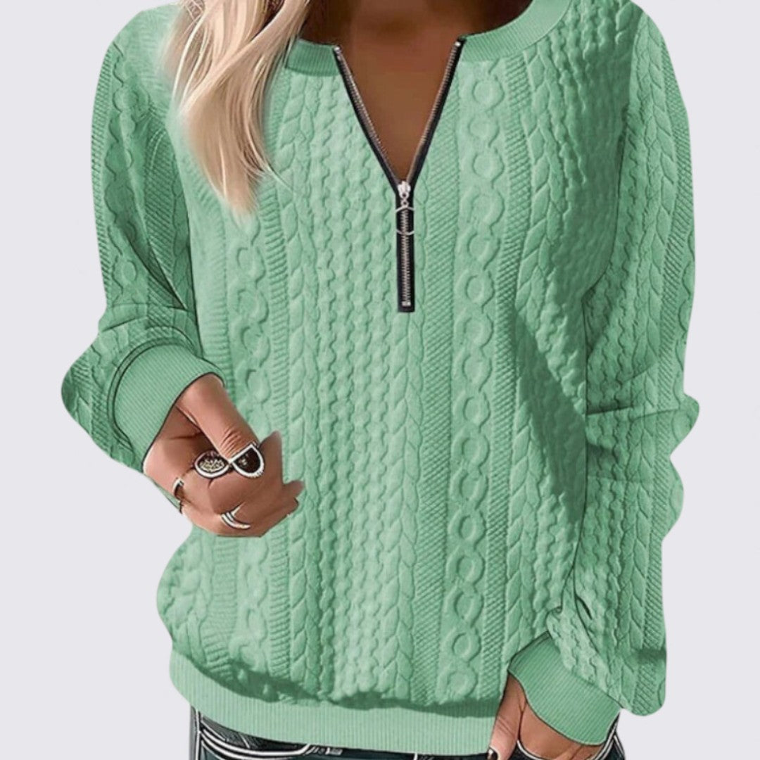 Pull à col zippé, coloris vert, vu de face