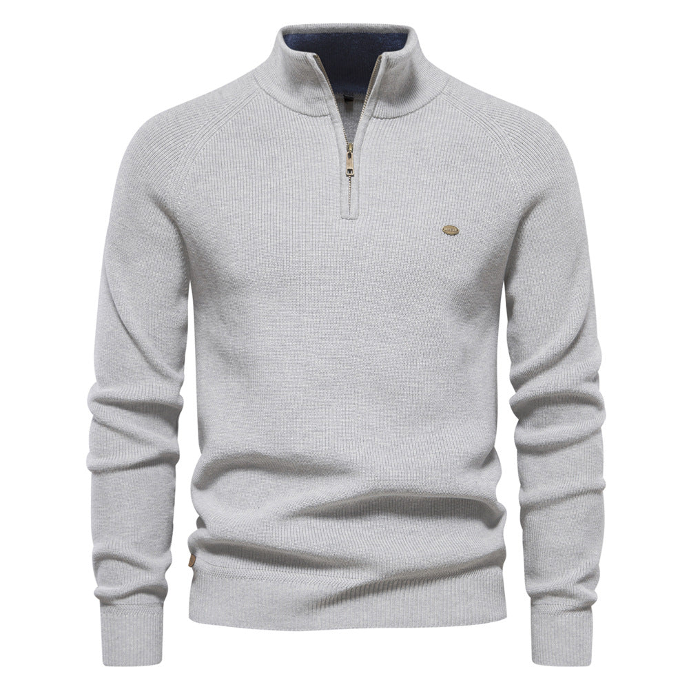Pull gris clair chiné à col montant zippé, intérieur de col bleu contrasté