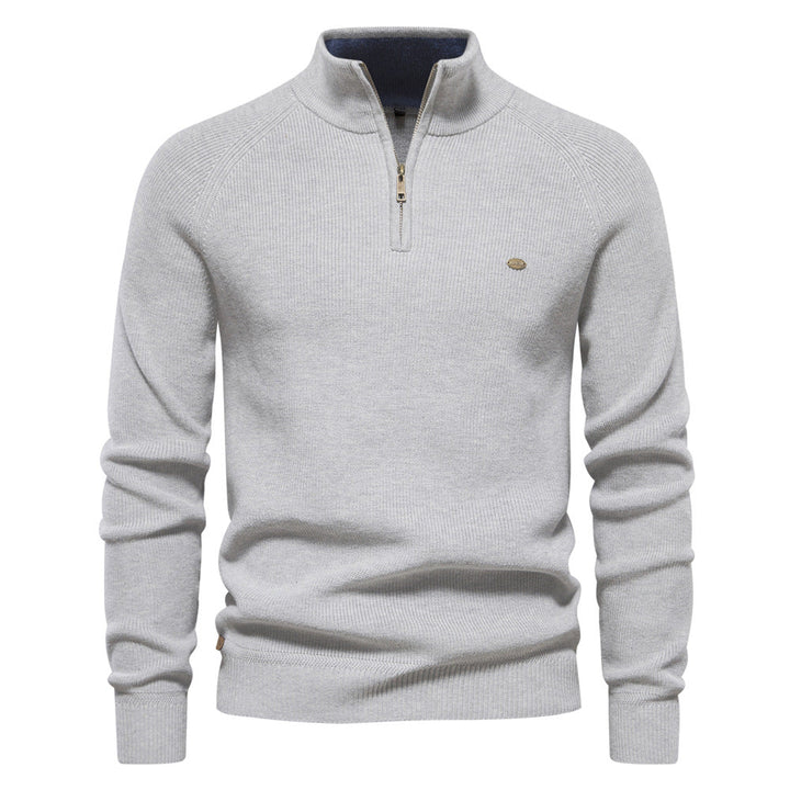 Pull gris clair chiné à col montant zippé, intérieur de col bleu contrasté