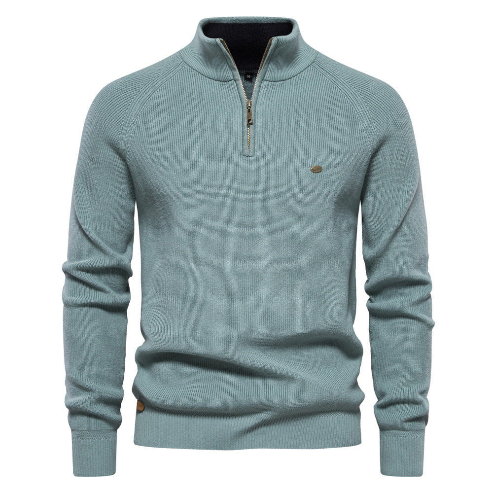 Pull vert céladon à col montant zippé, maille côtelée et poignets en bord-côte