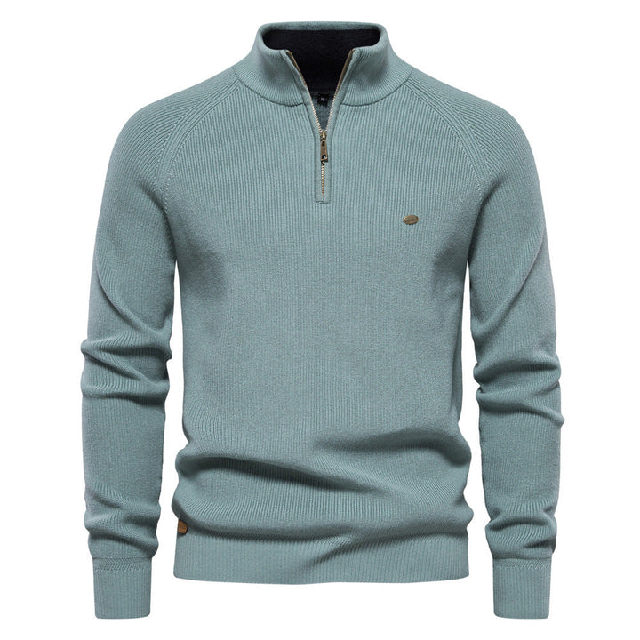 Pull vert céladon à col montant zippé, maille côtelée et poignets en bord-côte