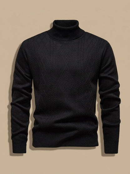 Pull col roulé noir à motif torsadé discret, présenté seul