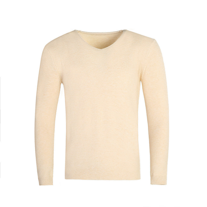 Pull col V crème en maille unie, présenté à plat