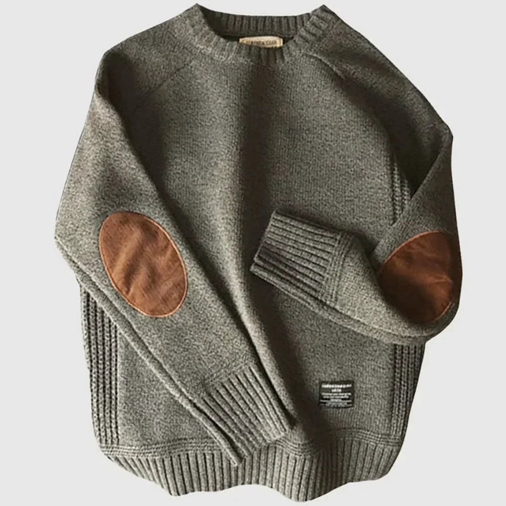 Pull col rond gris pour homme à coudières ovales, posé à plat
