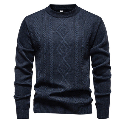 Pull à losanges bleu marine en maille fine, col rond, présenté à plat