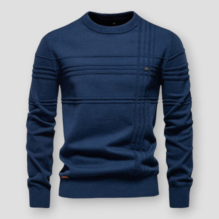 Pull bleu marine à col rond, rayures tricotées en relief et petit bouton sur le côté