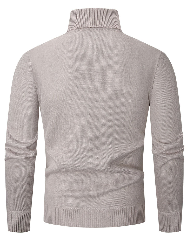 Dos du pull à col roulé crème, maille unie et large bord-côte dans le bas
