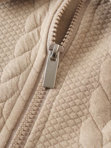 Pull torsadé col zippé