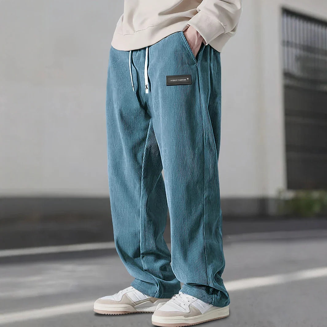 Pantalon en velours côtelé bleu canard à cordon, large côte et étiquette noire