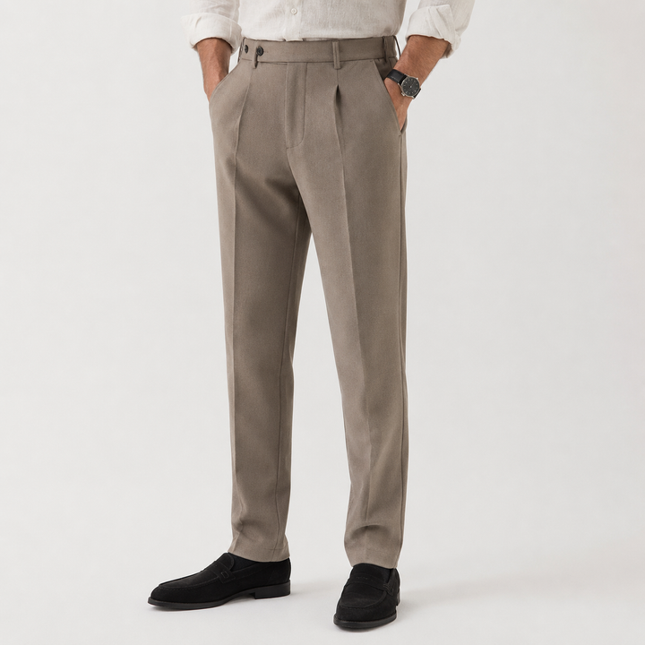 Taupe pleated front trousers with turn-ups worn on model with white shirt