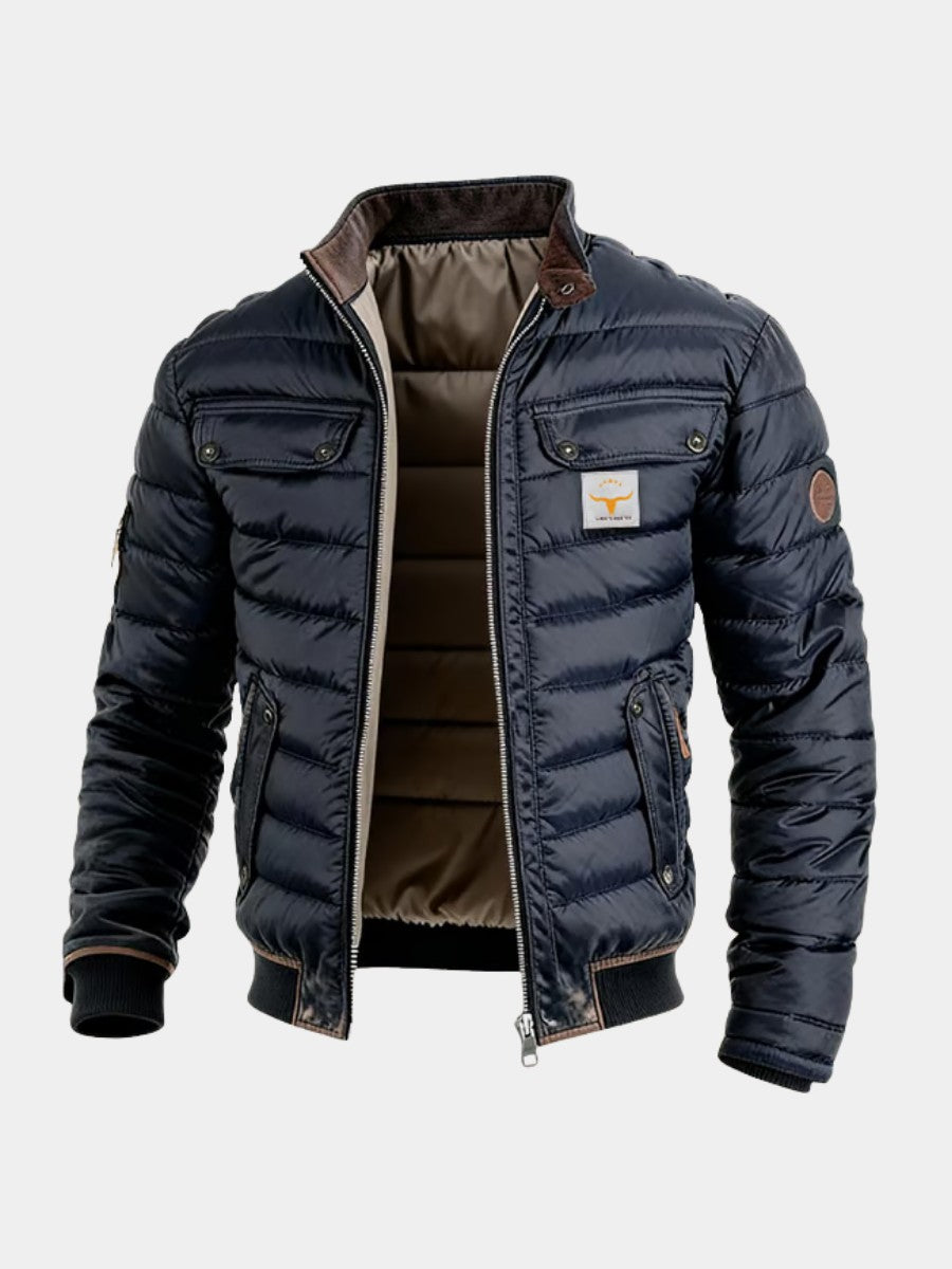 Veste matelassée bleu marine à col montant bordé de velours brun, ouverte sur sa doublure