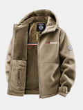 Veste polaire beige à capuche, ouverte sur sa doublure peluche et sa poche zippée